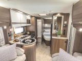 The Encore 255 has a rear corner double bed with an adjacent changing room/washroom