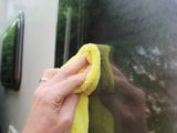Wiping away with microfibre cloth