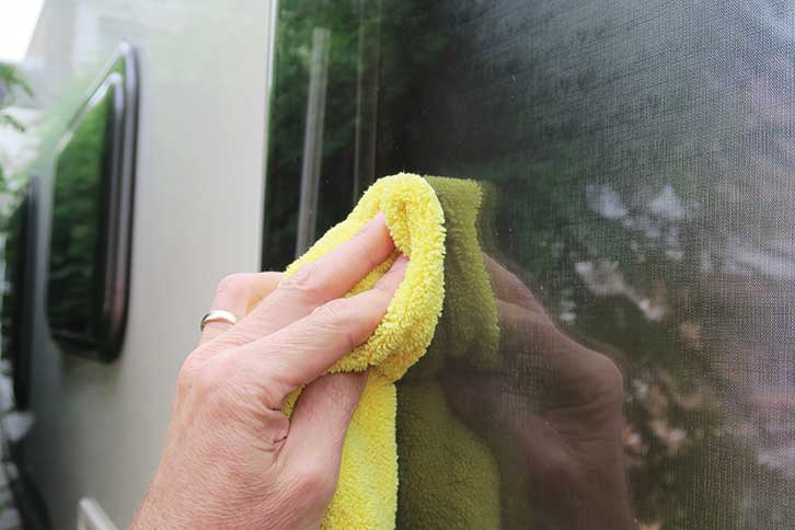 Wiping away with microfibre cloth