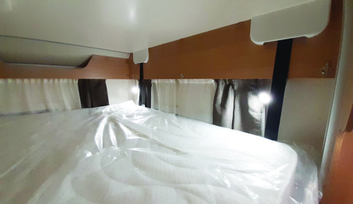 The adjustable reading lights above the drop-down double bed are useful