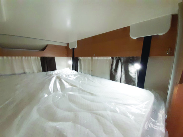 The adjustable reading lights above the drop-down double bed are useful