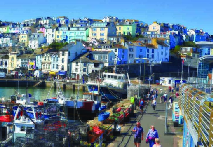 Brixham is a hilly town with pastel houses overlooking the busy harbour