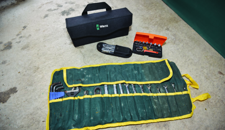 This is the bare minimum toolkit. 1/4-inch socket set, multi-tool, and a selection of spanners and Allen keys in a handy tool roll