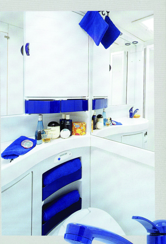 Blue and white shower room furniture, as in 2001, becomes fragile with age, but can be repaired, or better still, updated