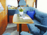 Hymer's seriously long extra-cost options list is legendary, so spec depends on the original beer's bank balance! Suffix 'L' after model number indicates inward-facing seat or Pullman dinette replaced by L-shaped settee, as pictured. 'U' indicates wrap-around rear lounge, and 'G' that permanent bed is closer to the ceiling to allow a full-size exterior-access garage below.