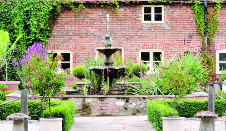 Picturesque fountain in the farmhouse gardens at Common Leys Farm