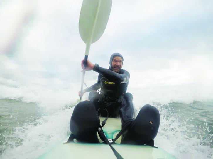 Monty braves the waves in his kayak - the campervan makes an ideal base for waterspouts fans