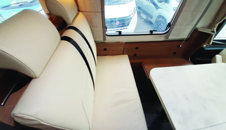 Comfortable seating includes two belted travel seats in the lounge