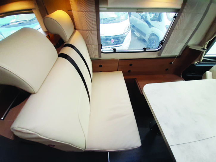 Comfortable seating includes two belted travel seats in the lounge