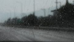 Looking out of a vehicle's window in wet weather