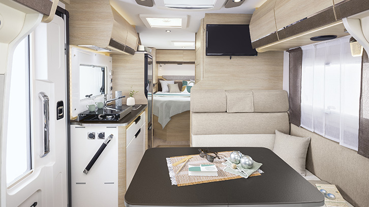 Rapido C50 interior photo showing the kitchen area, seating area and bedroom