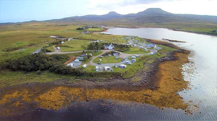 An aerial view of Kinloch Campsite with the Loch in the background