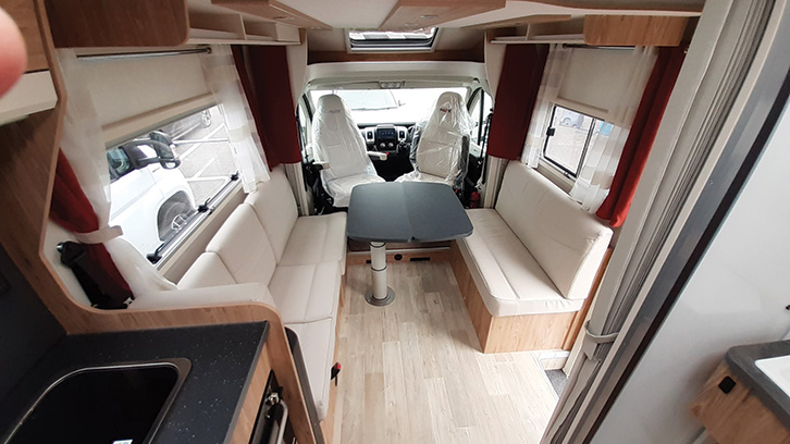 Interior photo of the Pilote 626D Evidence showing the sofas and table