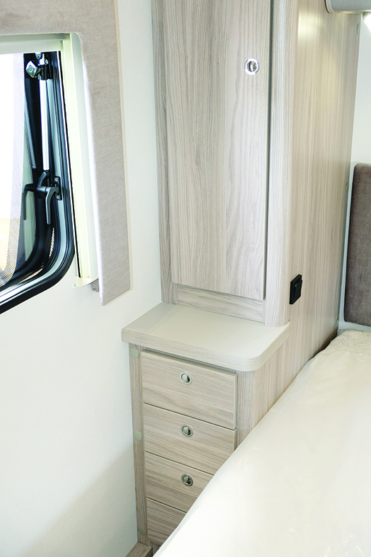 Loads of space for clothes and books in the lockers and cupboards around the island bed