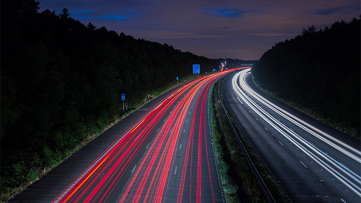 A busy motorway with traffic flowing in both directions