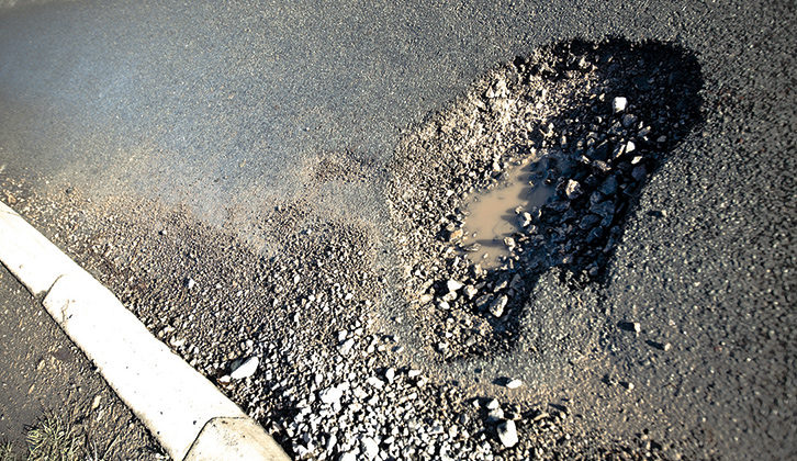 A pothole in the middle of the road