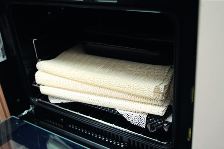 Wrap oven trays to protect them whole you're on the move