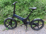A GoCycle ebike parked on a path