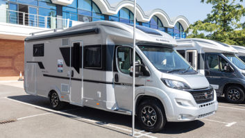 An Adria motorhome parked on a dealer forecourt
