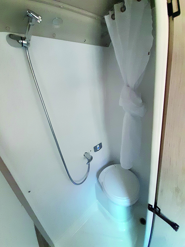 You can enclose the shower with a curtain that wraps around all sides