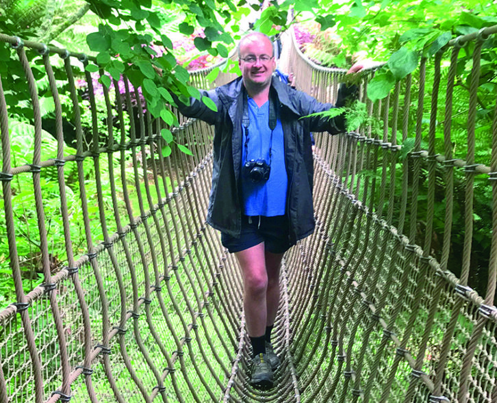 Sam ventures out onto the rope bridge