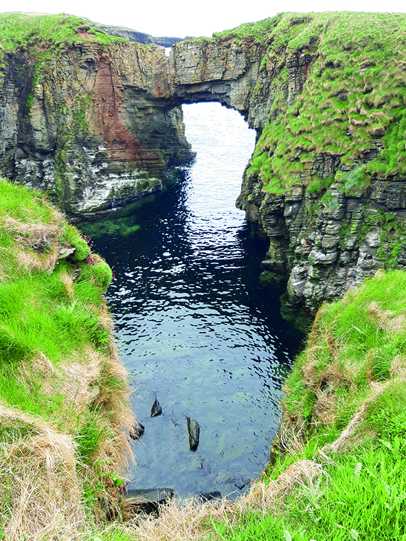 It's well worth the walk to see the dramatic sea arch at Vat of Kirbister