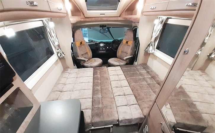 The interior of the Auto-Sleeper Nuevo EK with chairs swivelled round
