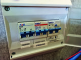 RCD trip switches protect each mains circuit from faults and will cut power to live and neutral if they sense any current imbalance. 'Up' will usually denoted 'on'
