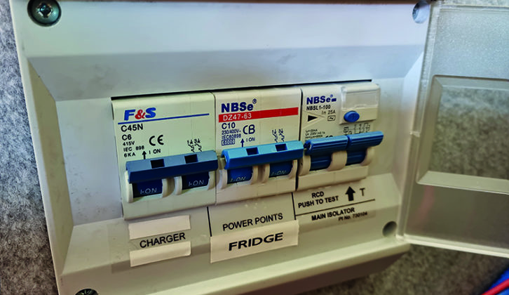 RCD trip switches protect each mains circuit from faults and will cut power to live and neutral if they sense any current imbalance. 'Up' will usually denoted 'on'