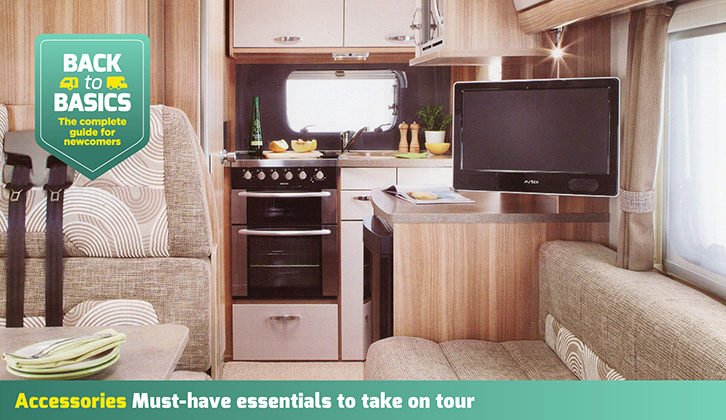 A TV set up on a sideboard in a motorhome