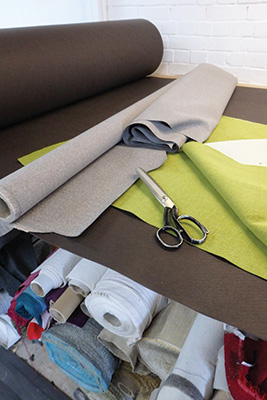 Scissors laying on top of fabric