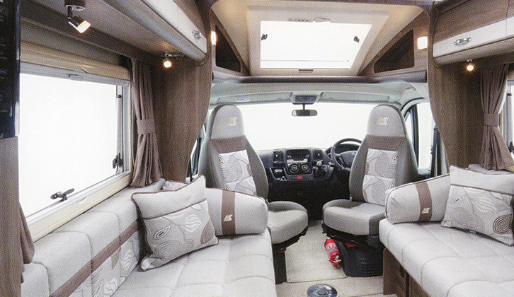 The lounge of the Auto-Sleeper Nuevo, with the front seats swivelled inwards