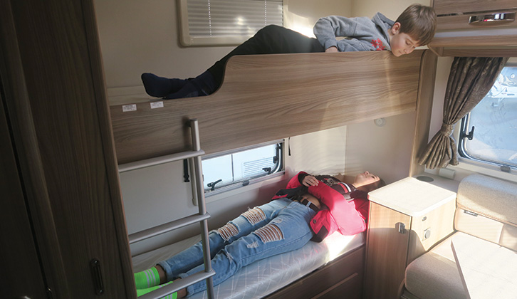 Two children in bunkbeds in a motorhome