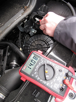 A multimeter being used to check the level of charge