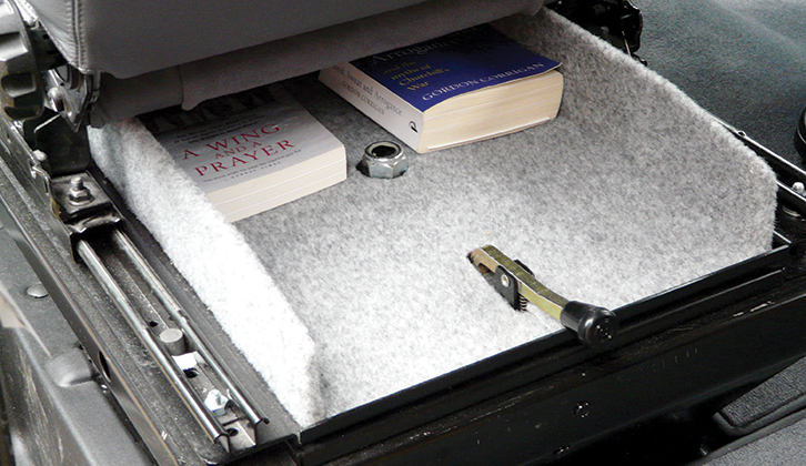 An underseat book tray