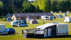 Motorhomes and caravans pitched up on a sunny day