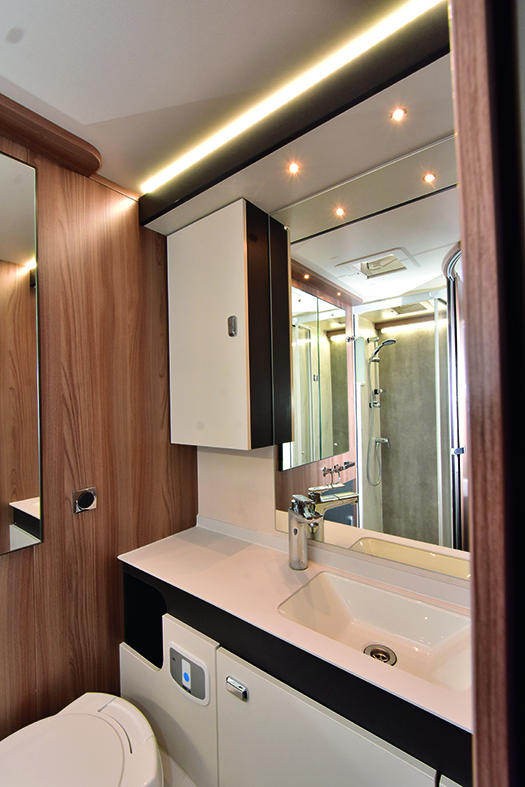 Stylish washroom has plenty of storage space and a new, improved handbasin design