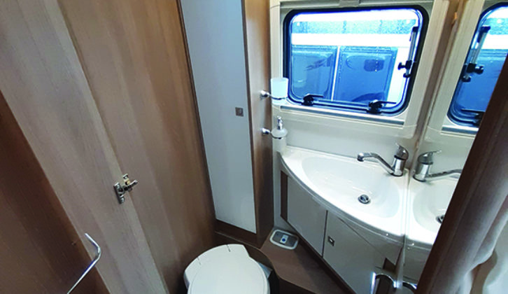 Washroom straddles the 'van, with the toilet area opposite the shower cubicle...