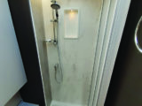 The shower cubicle offers excellent headroom and a suitably long riser bar