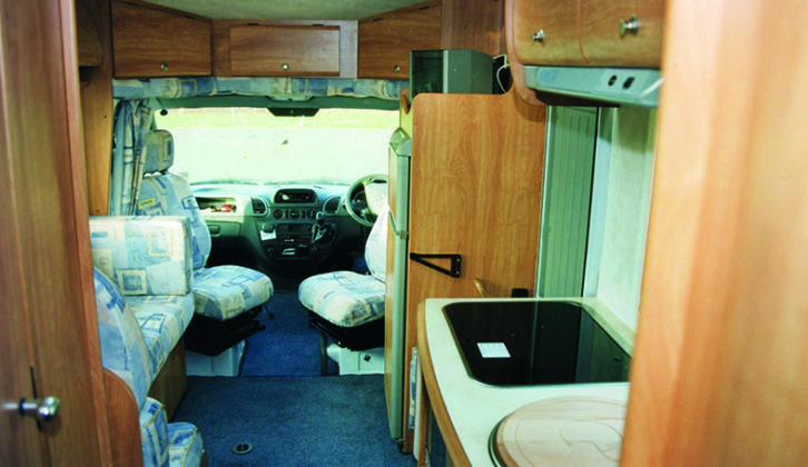 View forward in a 645TC. Note useful extra storage lockers in low-profile overcab and huge fridge-freezer placed just forward of the offside habitation door