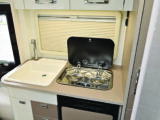 Kitchen worktop is limited and you only get a two-burner gas hob, but the large sink has a heavy-duty cover that adds to work surface