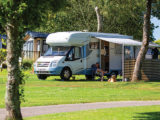 A motorhome pitched up at Heligan Caravan and Camping Park