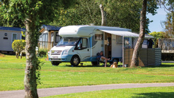 A motorhome pitched up at Heligan Caravan and Camping Park