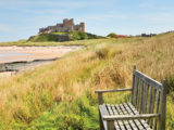 Bamburgh Castle in the distance on a clear day