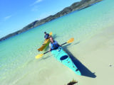 The clear waters of Achmelvich Bay are ideal for kayaking
