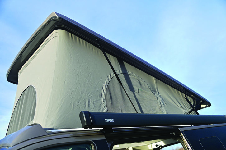 Raising roof lifts on gas struts and offers plenty of headroom
