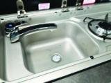 Kitchen sink can accommodate washing up when required, and is smartly finished to complement charcoal work surface