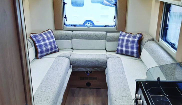 Comfortable lounge gains plenty of natural light from large windows at the rear and sides