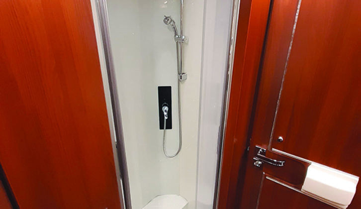 Shower cubicle features a pair of plugholes and a roof light