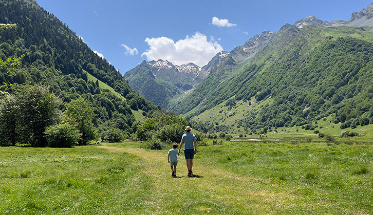 Marcus Leach and one of his children standing in a valley